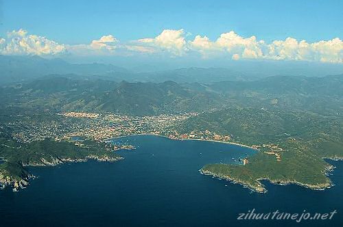 The Bay of Zihuatanejo and the Sierra Madre del Sur mountains